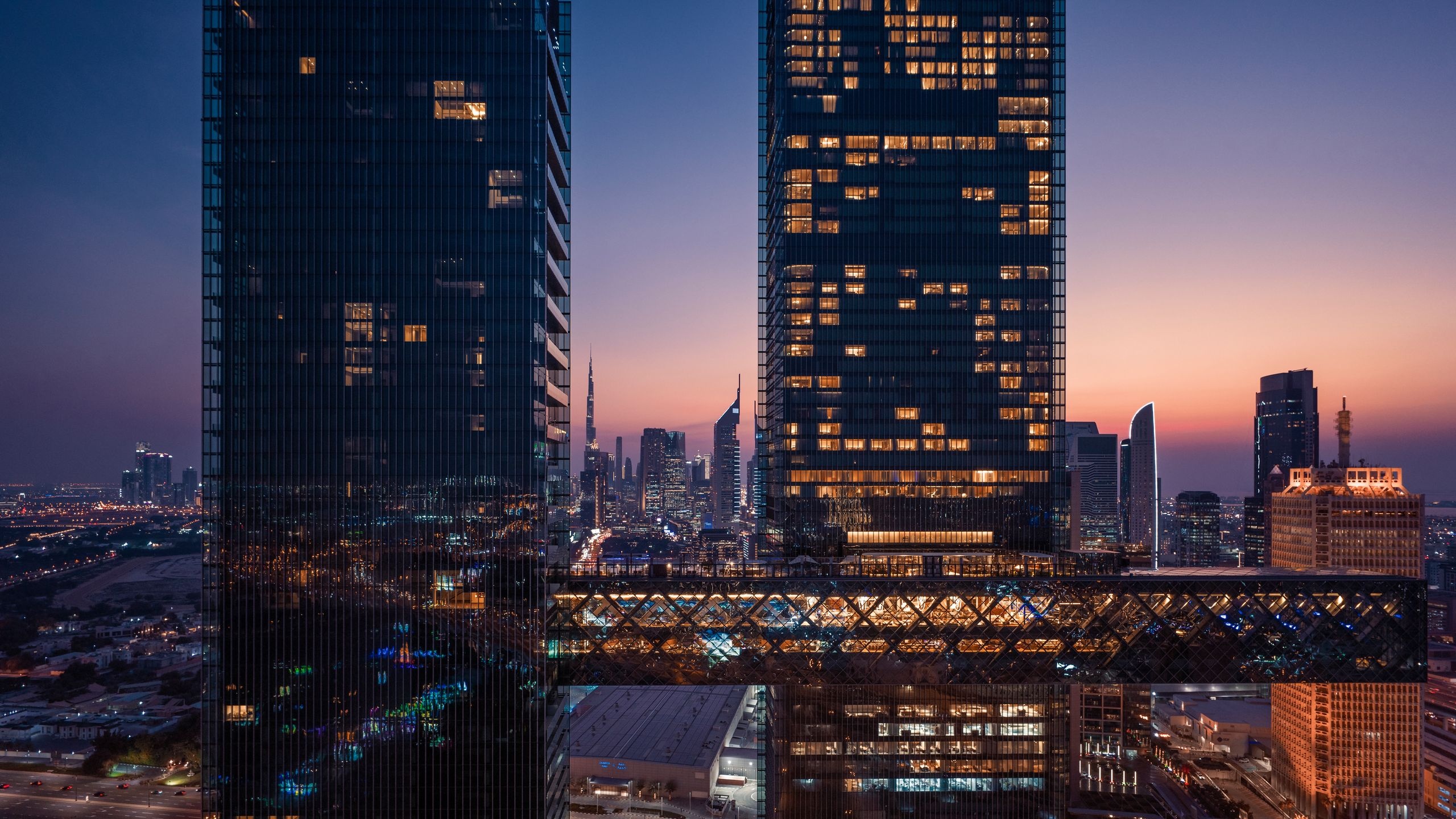 Modern luxury building exterior with dramatic twilight lighting